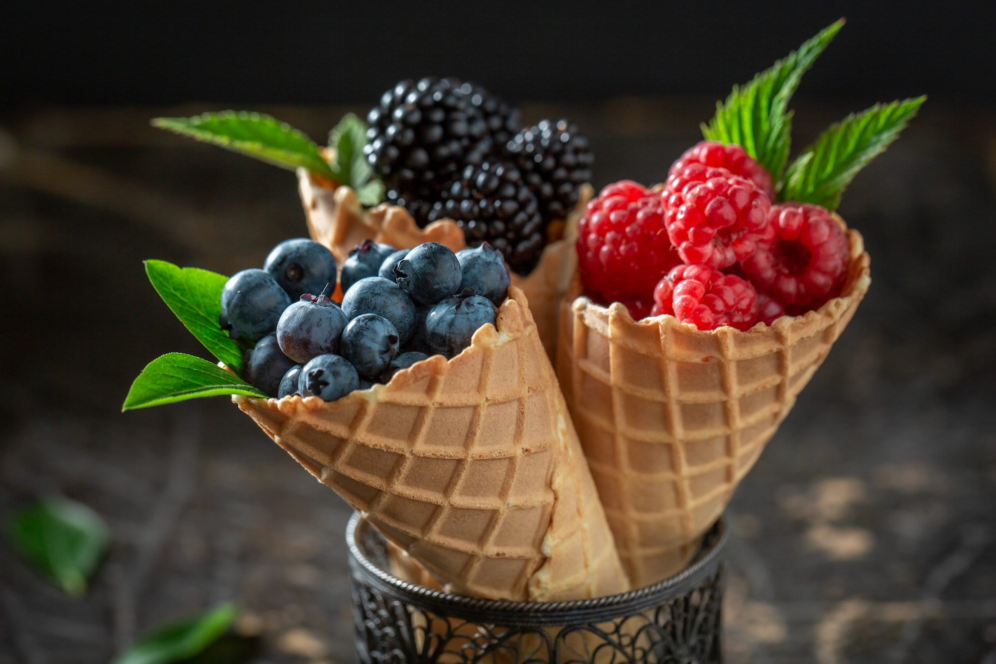 Delicious berry fruits in waffels as homemade ice cream